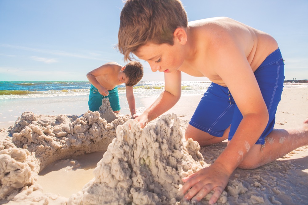 boys playing in the sand at Mexico Beach Florida; Mexico Beach Sandcastles