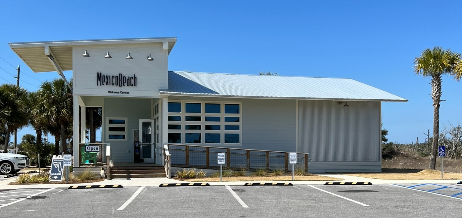 a family riding bikes along hwy 98