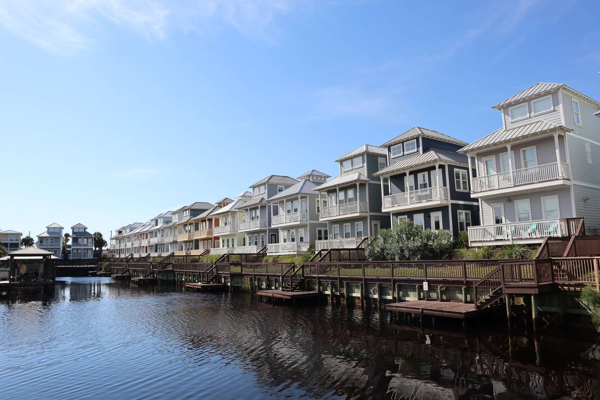 three kids smiling and having fun at the beach