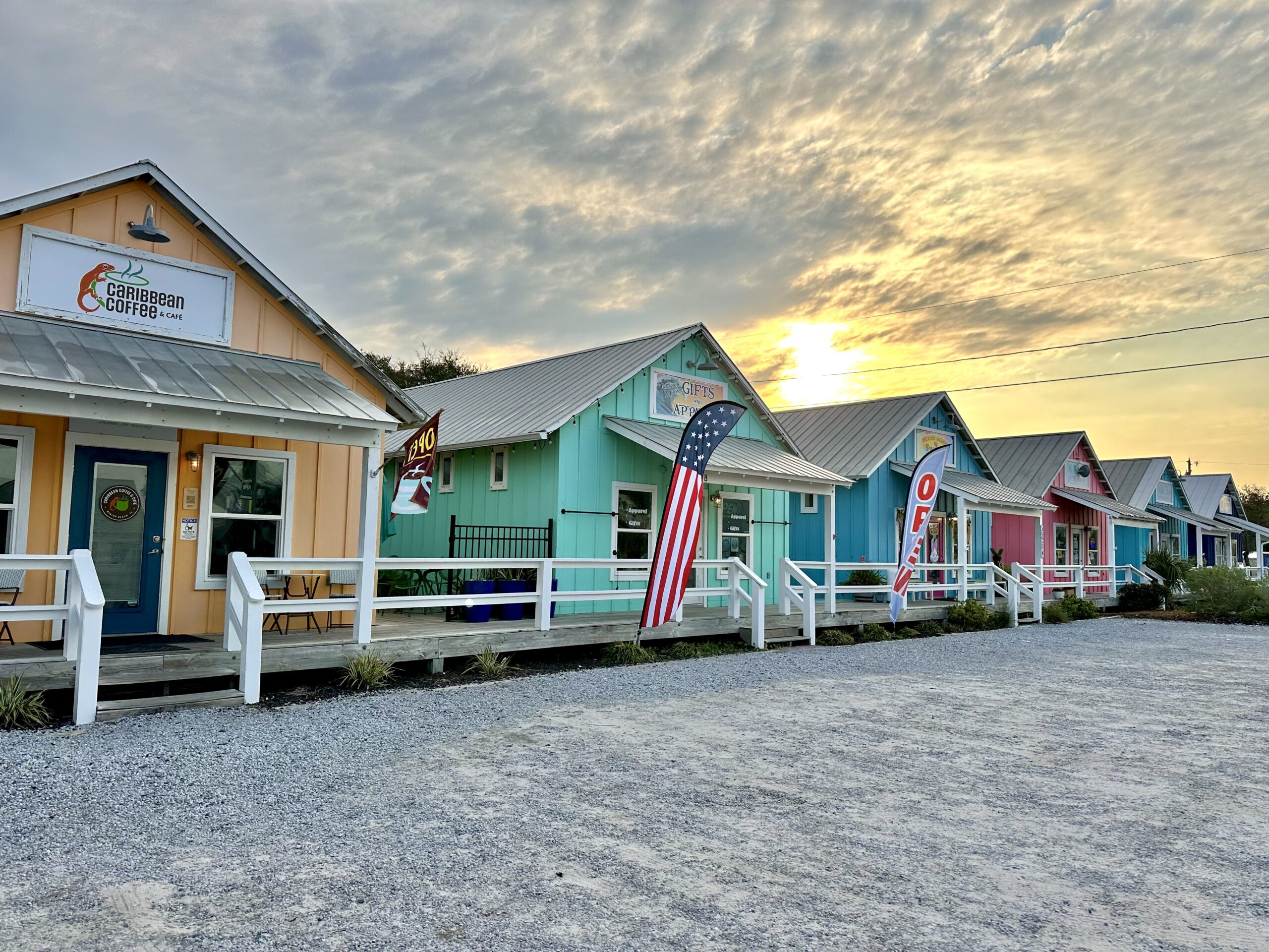 a family with an umbrella set up at the beach
